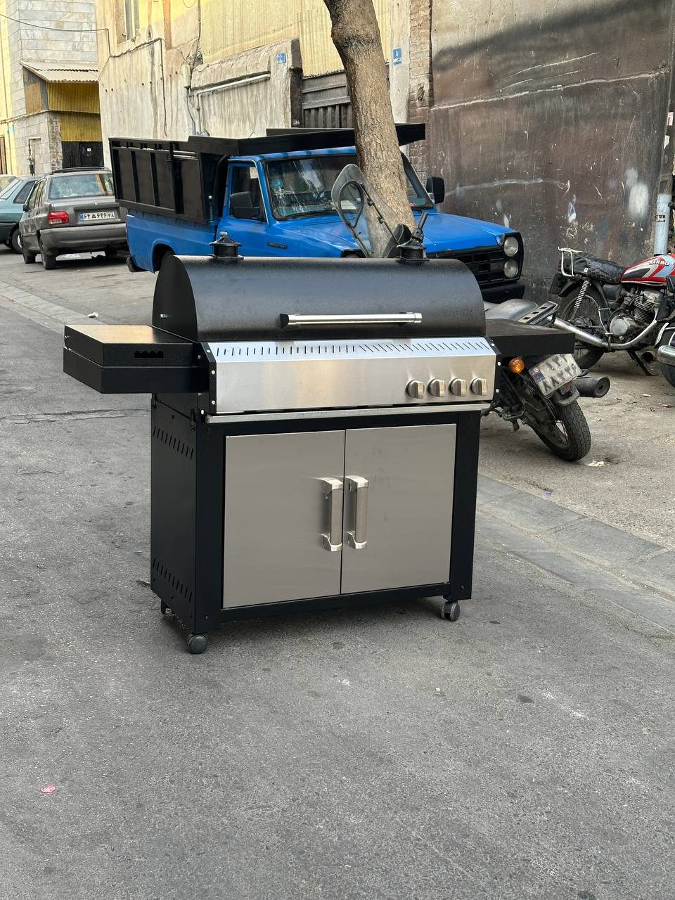 باربیکیو کابینت دار محفظه استیل پلوپزدار  لوله و محفظه استیل 304 نگیر ضد زنگ درب دوجداره گریل دار رویه چدنی کباب پز منقل گازی باربیکیو محمد